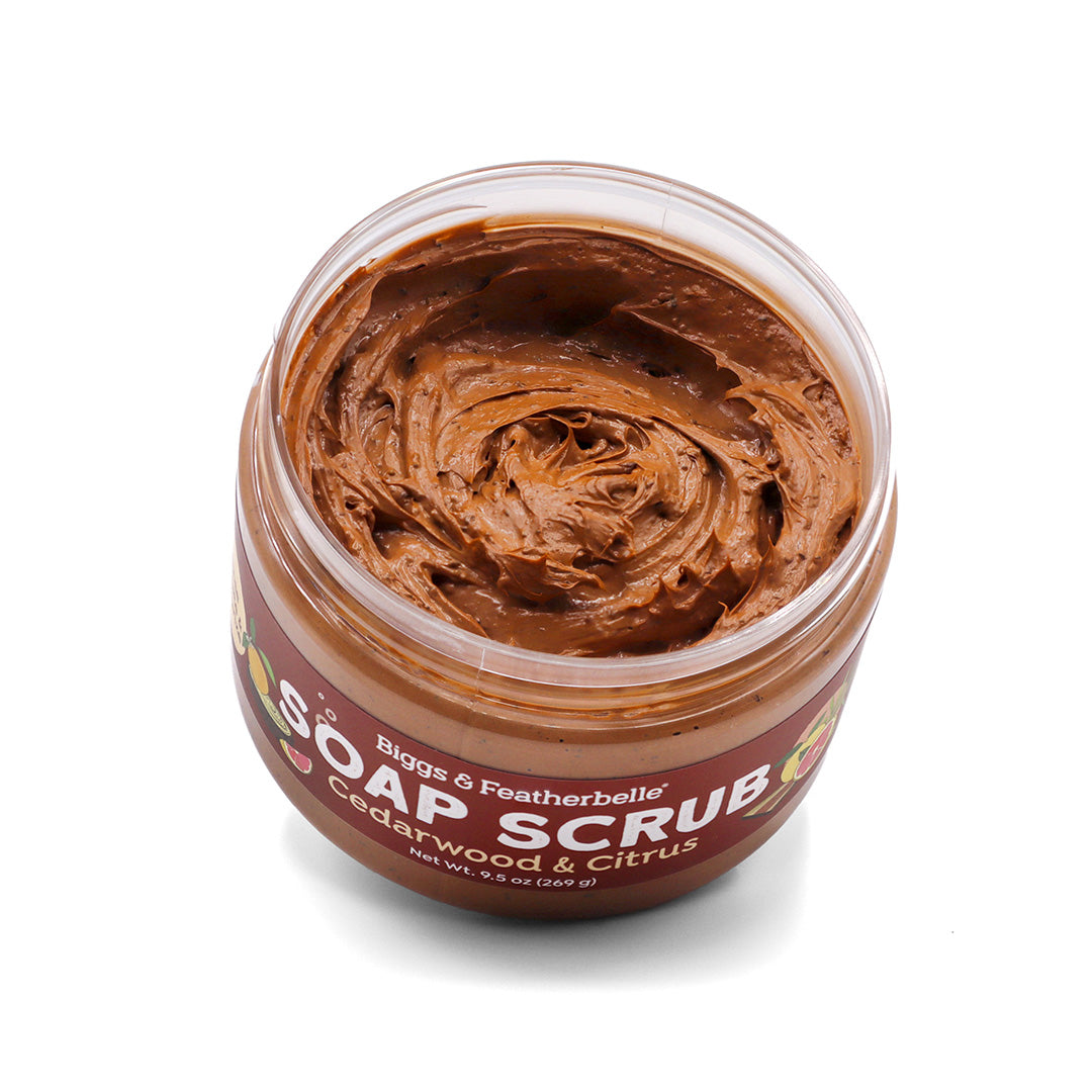 Opened jar of Cedarwood & Citrus Soap Scrub on a white background