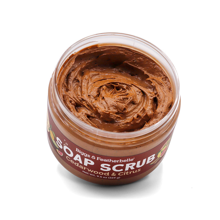 Opened jar of Cedarwood &amp; Citrus Soap Scrub on a white background