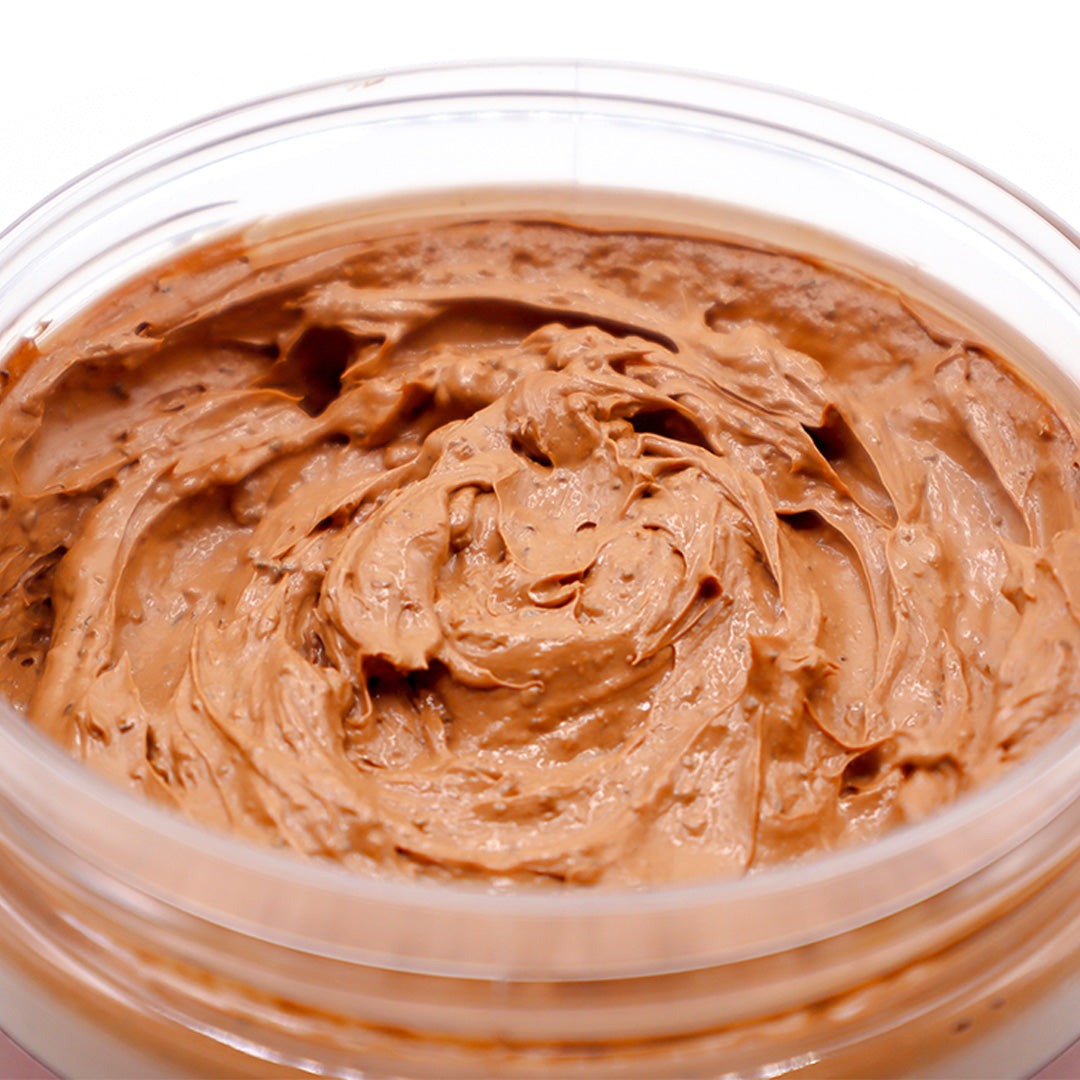 Close-up of cedar soap scrub in a clear container