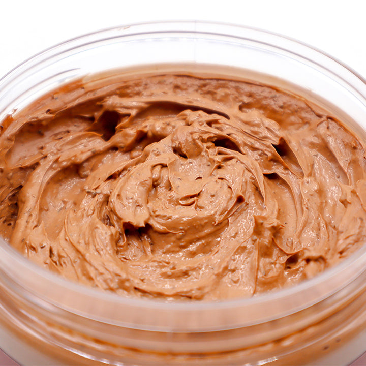 Close-up of cedar soap scrub in a clear container