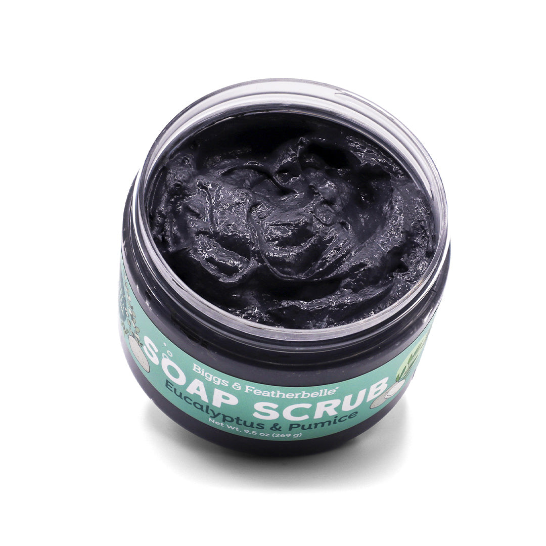 Opened jar of Biggs &amp; Featherbelle Soap Scrub on a white background