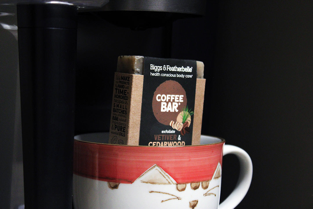Coffee bar packaging in a mug with a black background